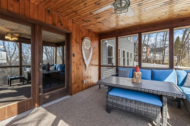 sunroom / solarium featuring wood ceiling and ceiling fan