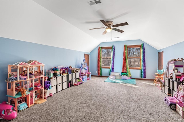 rec room featuring visible vents, carpet, ceiling fan, and vaulted ceiling