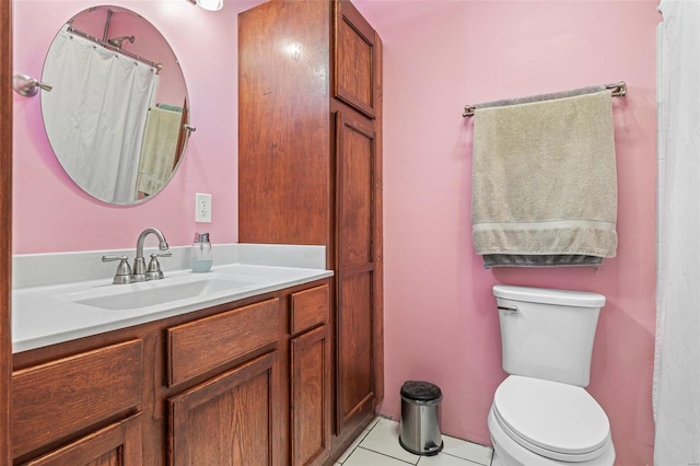 bathroom featuring tile patterned floors, toilet, and vanity