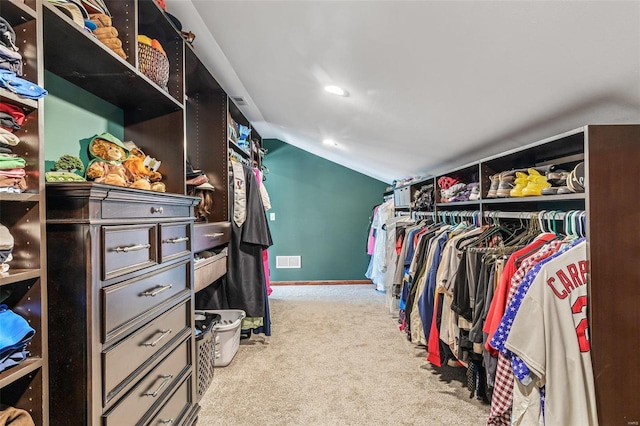 walk in closet featuring vaulted ceiling, carpet, and visible vents