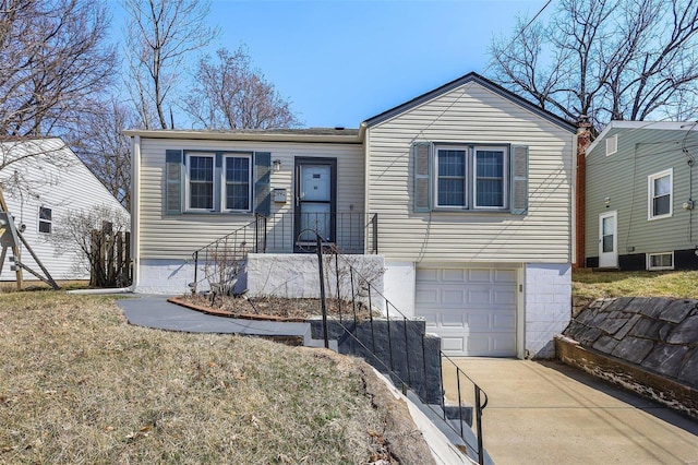 view of front of home with driveway and an attached garage