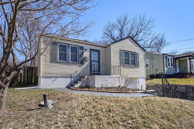 view of front of house featuring fence