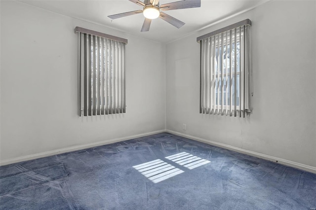 empty room featuring baseboards, carpet, and a ceiling fan