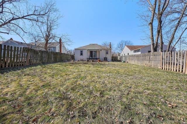 view of yard featuring a fenced backyard