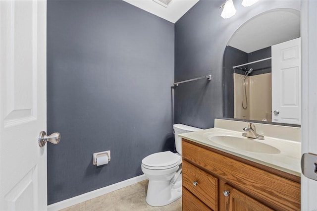 full bath featuring tile patterned flooring, baseboards, walk in shower, toilet, and vanity