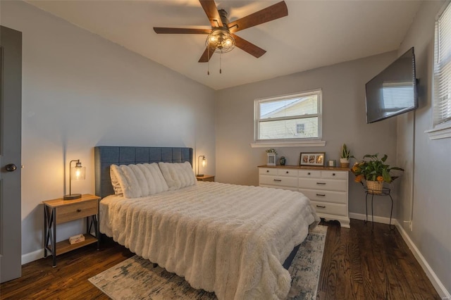 bedroom with lofted ceiling, dark wood-style floors, baseboards, and ceiling fan