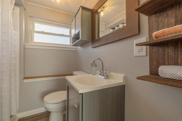 full bathroom with a shower with curtain, toilet, wood finished floors, baseboards, and vanity