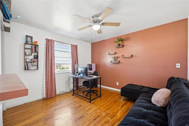 office space with ceiling fan, light wood-type flooring, and baseboards