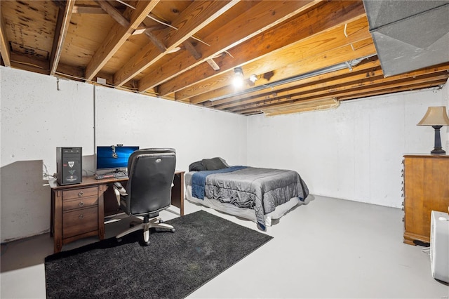 bedroom featuring concrete flooring