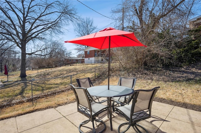 view of patio / terrace with outdoor dining space and fence