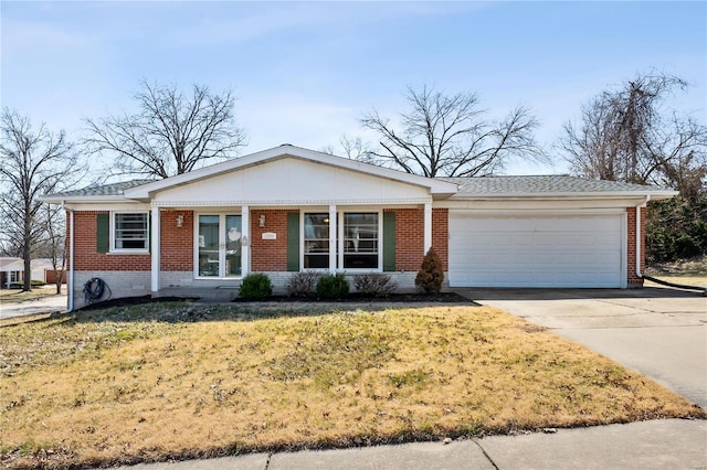 ranch-style home with a garage, a front lawn, brick siding, and driveway