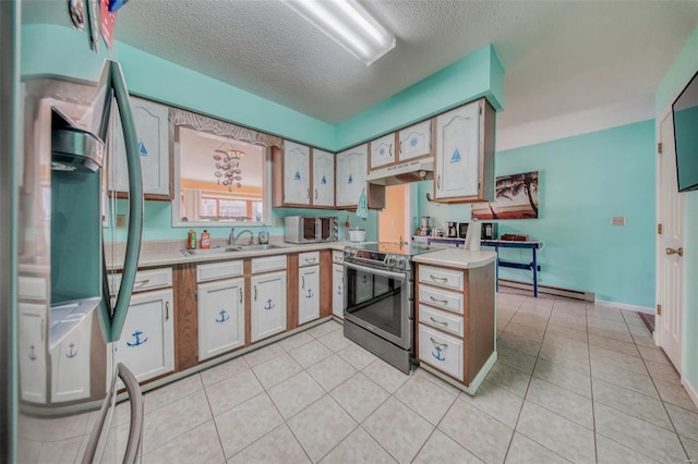 kitchen with a sink, under cabinet range hood, stainless steel appliances, light countertops, and light tile patterned floors