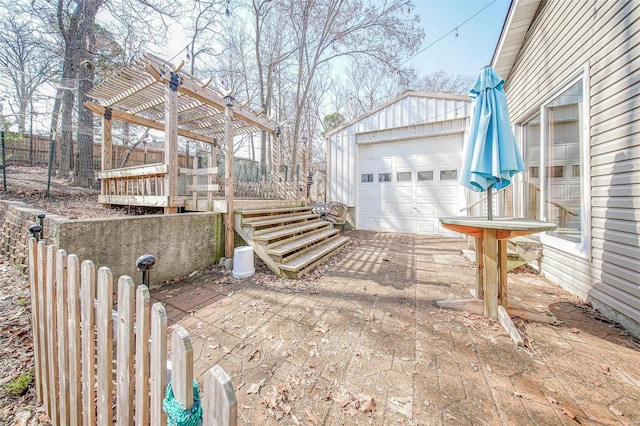 exterior space with a detached garage, an outbuilding, a pergola, and a wooden deck