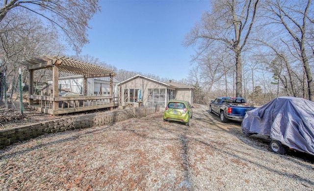 view of yard with a pergola and a wooden deck