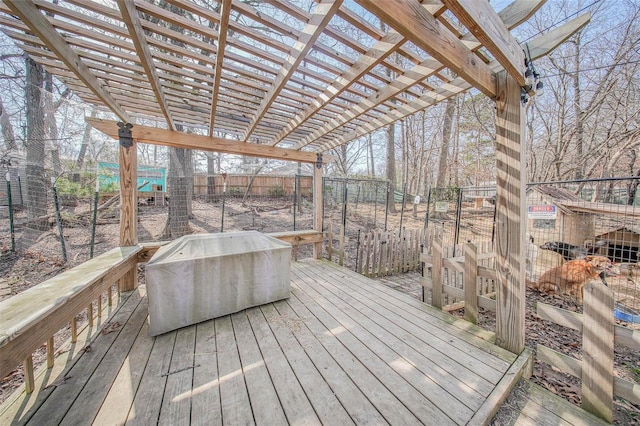 wooden terrace with fence and a pergola