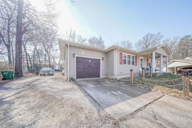 view of front of home featuring concrete driveway and a garage