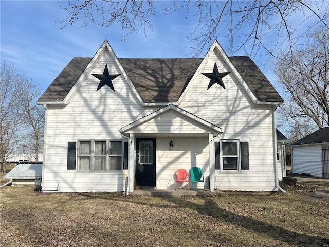 view of front of home with a shingled roof