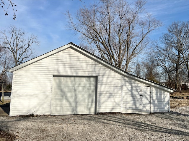 exterior space featuring an outbuilding and driveway