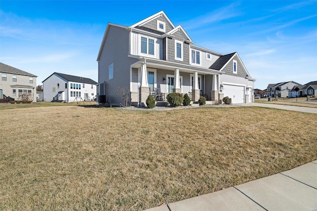 view of front of home featuring central air condition unit, a residential view, a front yard, covered porch, and driveway