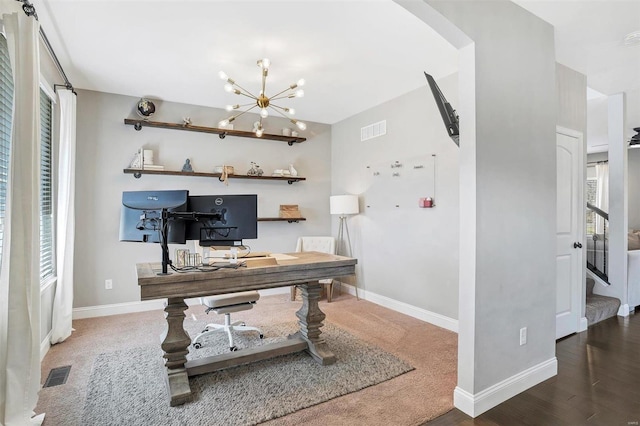 office area featuring visible vents, baseboards, and a healthy amount of sunlight