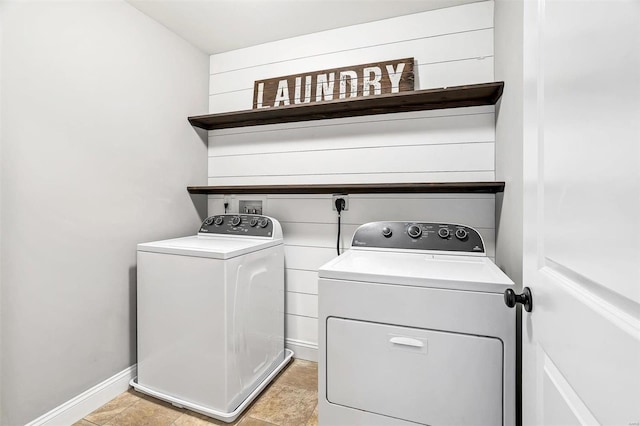 laundry area with laundry area, baseboards, and separate washer and dryer