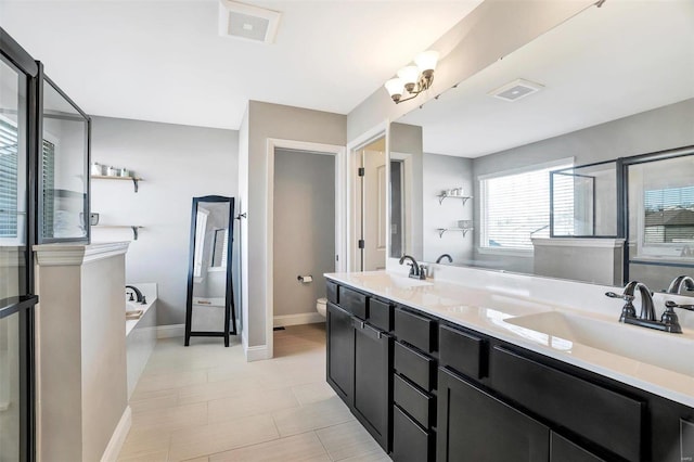 full bath featuring a bath, visible vents, toilet, and a sink