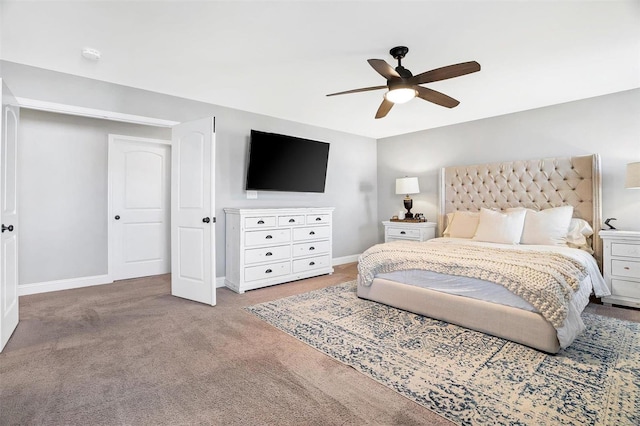 carpeted bedroom with baseboards and a ceiling fan