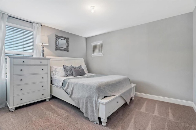 bedroom featuring baseboards and carpet floors