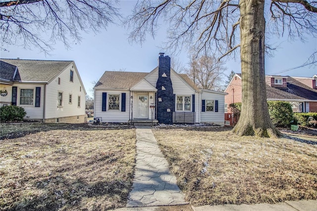 bungalow-style house with a chimney