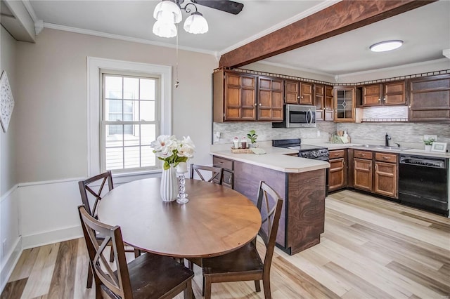 kitchen featuring stainless steel microwave, black dishwasher, ornamental molding, range with electric stovetop, and a peninsula