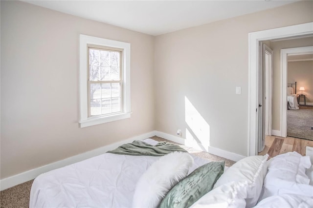 bedroom featuring baseboards