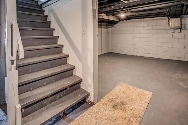 unfinished basement with stairway