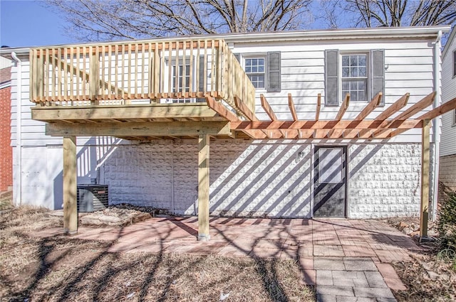 rear view of house featuring cooling unit and stairs