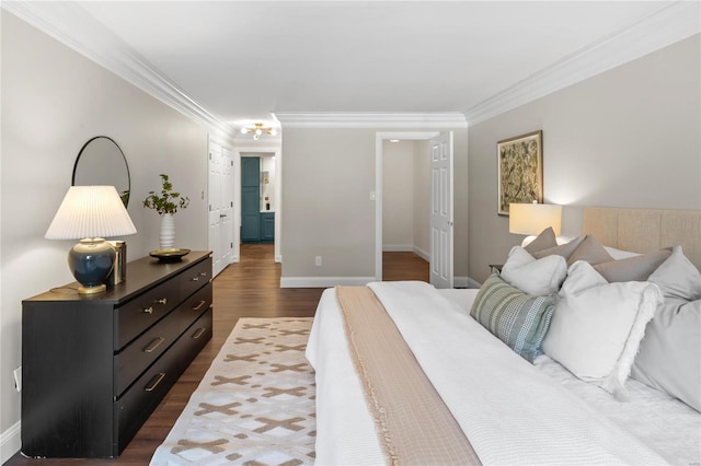 bedroom with baseboards, dark wood-style floors, and crown molding