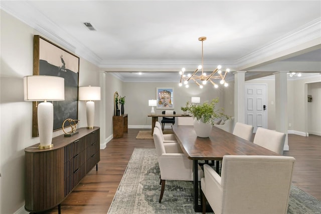 dining space with crown molding, wood finished floors, visible vents, and baseboards