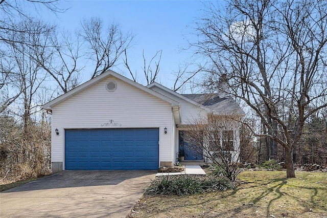 ranch-style home with concrete driveway and a garage