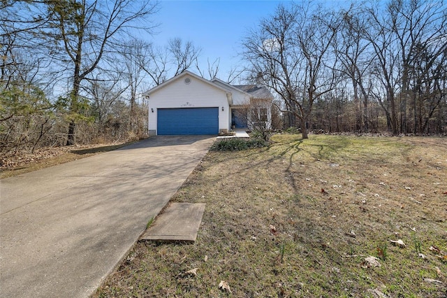 view of property exterior featuring concrete driveway and an attached garage