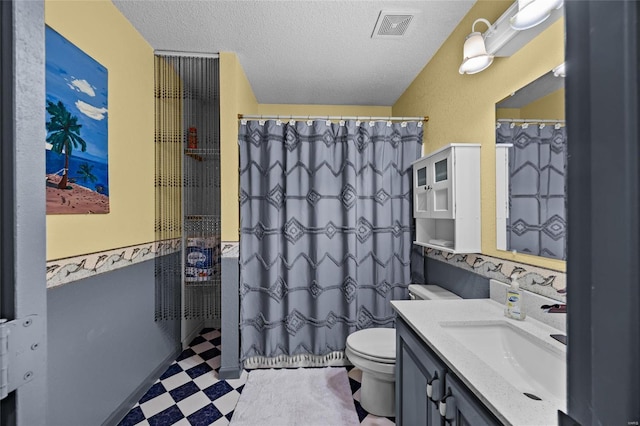 full bath featuring tile patterned floors, visible vents, toilet, a textured ceiling, and vanity