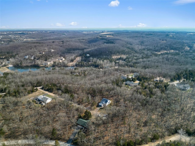 aerial view featuring a wooded view