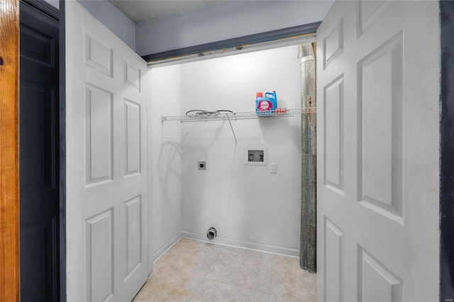 laundry area featuring laundry area, light tile patterned floors, hookup for a washing machine, electric dryer hookup, and baseboards