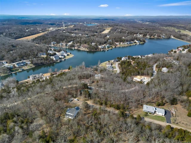 aerial view featuring a water view and a forest view