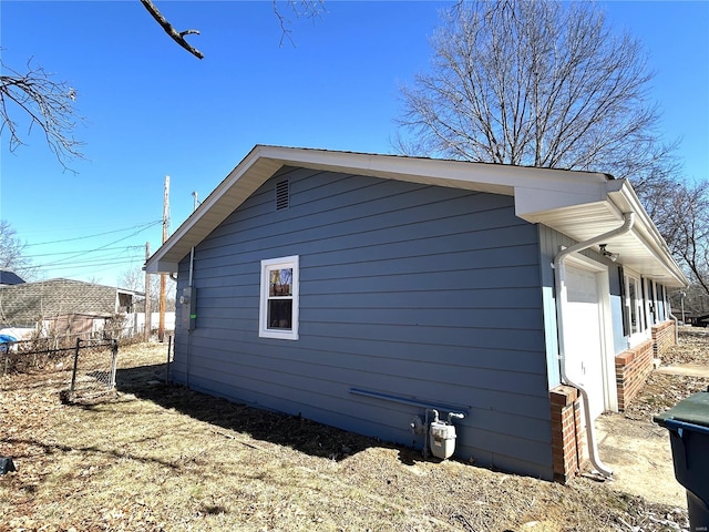 view of side of property with fence