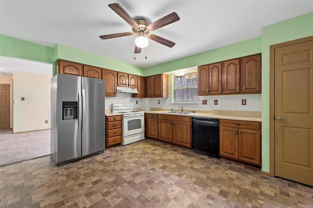 kitchen with white electric range oven, stainless steel fridge with ice dispenser, a sink, black dishwasher, and under cabinet range hood