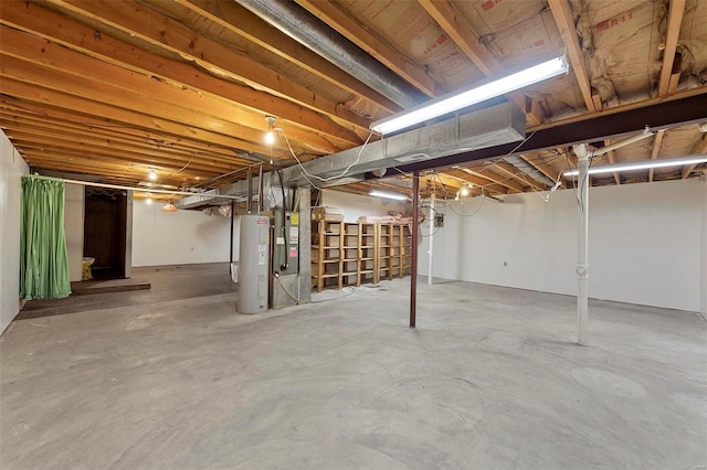 unfinished basement featuring electric water heater