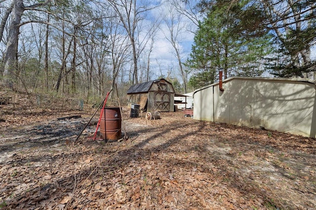 view of yard with an outbuilding and a storage shed