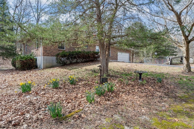 view of front of house with brick siding and a garage