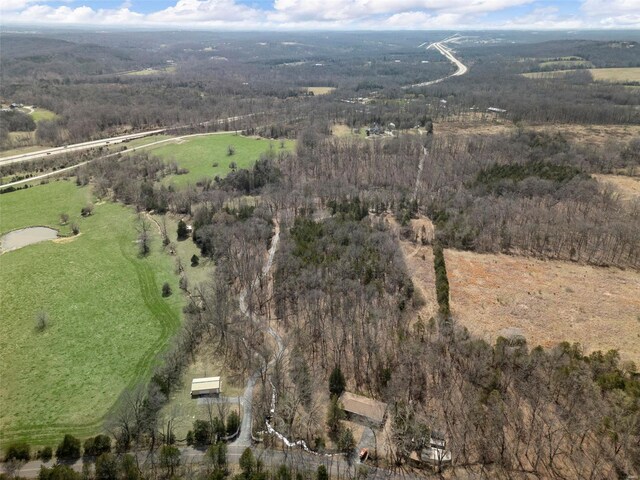 birds eye view of property featuring a rural view