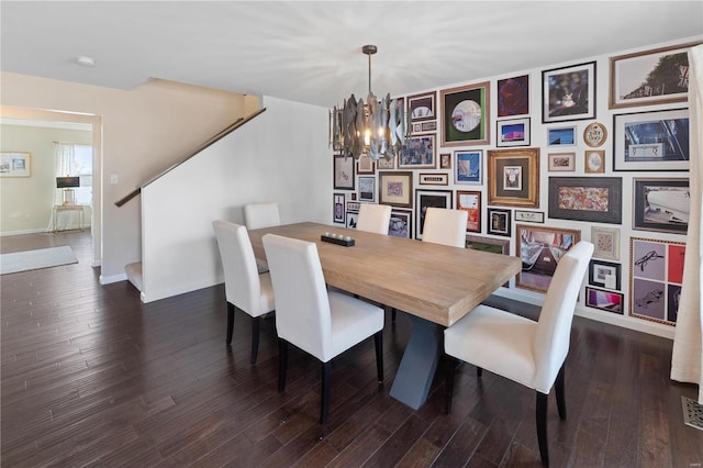 dining space with baseboards, an inviting chandelier, dark wood-style flooring, and stairs