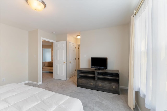 bedroom with baseboards and carpet flooring