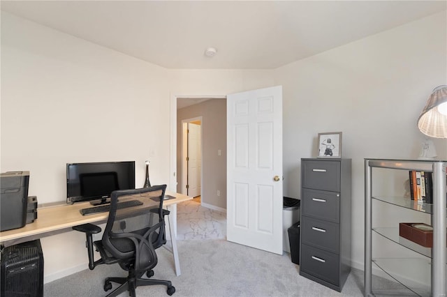 home office featuring light colored carpet and baseboards